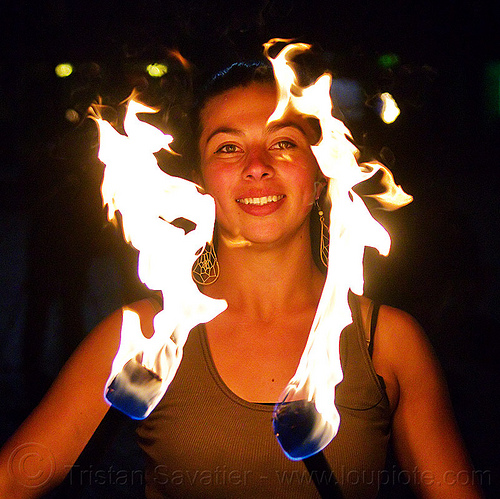 savanna breese spinning douple fire staff, double staff, fire dancer, fire dancing, fire performer, fire spinning, fire staffs, night, savanna, staves, woman