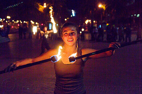 savanna spinning double fire staff, double staff, fire dancer, fire dancing, fire performer, fire spinning, fire staffs, night, savanna, staves, woman