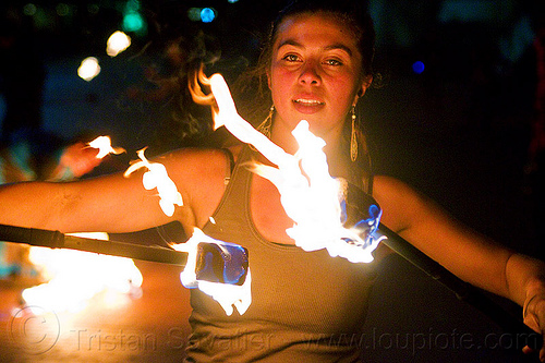 savanna spinning double fire staff, double staff, fire dancer, fire dancing, fire performer, fire spinning, fire staffs, night, savanna, staves, woman