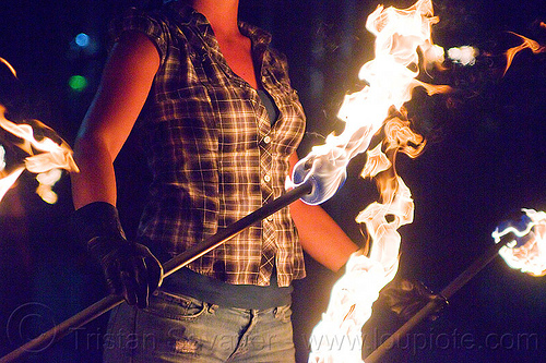 savanna spinning fire staffs, double staff, fire dancer, fire dancing, fire performer, fire spinning, fire staffs, fire staves, leather gloves, night, savanna, spinning fire, woman