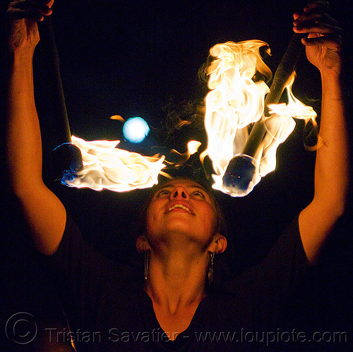 savanna spinning fire staffs under the full moon, double staff, fire dancer, fire dancing, fire performer, fire spinning, fire staffs, fire staves, full moon, night, savanna, spinning fire, woman