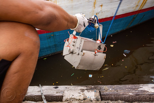 scientists use a dredge sampler in the makassar harbor, day grab, dredge sampler, makassar