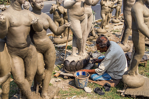 sculptor making clay sculptures on road side (india), bucket, clay, india, man, sculptor, sculptures, statues, west bengal, working