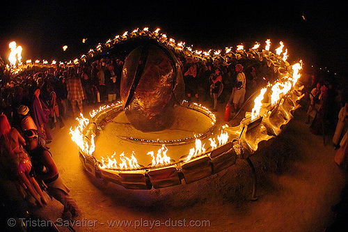 serpent mother's egg - giant snake skeleton fire sculpture - burning-man 2006, art installation, burning man at night, fire, sculpture, serpent mother, skeleton, snake