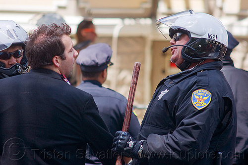 sfpd police arresting peaceful reveler - bay to breakers (san francisco), arresting, baton, bay to breakers, crack-down, law enforcement, mass arrest, men, motor cop, motor officer, motorcycle police, police arrest, sfpd, street party, under arrest, uniform