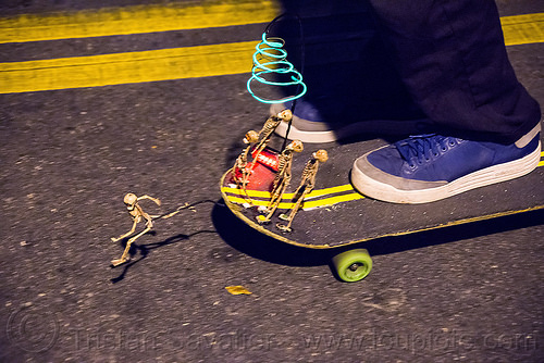 skateboard with small skeletons - dia de los muertos, day of the dead, dia de los muertos, double yellow line, el-wire, halloween, night, riding, shoes, skateboard, skateboarding, toy skeletons