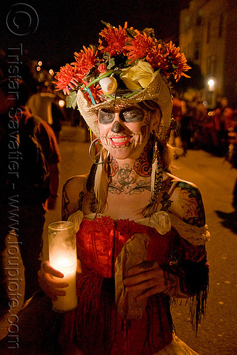 skull makeup - hat with flowers - dia de los muertos - halloween (san francisco), candle, day of the dead, dia de los muertos, face painting, facepaint, halloween, hat, headdress, makeup, night, red flowers, woman