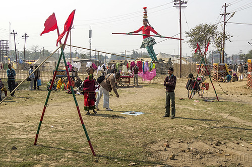 slacklining - slack rope walking - young street circus performer (india), acrobat, balancing pole, balancing stick, child, circus act, circus artist, circus performer, circus show, equilibrist, hindu pilgrimage, hinduism, kid, kumbh mela, little girl, rope walker, rope walking, slack rope, slacklining, street circus, traveling circus, woman