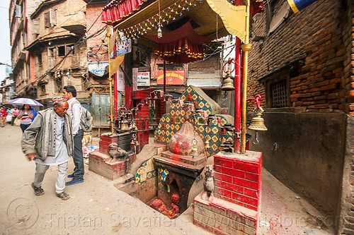 small hindu shrine in kathmandu street (nepal), balkumari, bells, ganesh, ganesha, hindu shrine, hinduism, kathmandu, men, sunken shrine