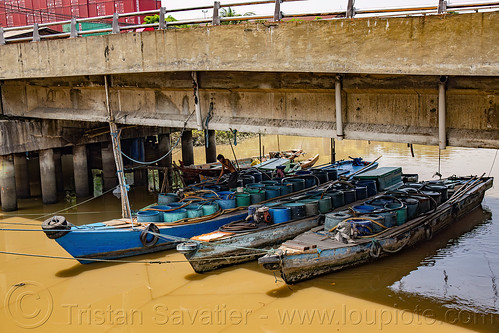 small river boats carrying barrels of water, barrels, bridge, river boats, surabaya