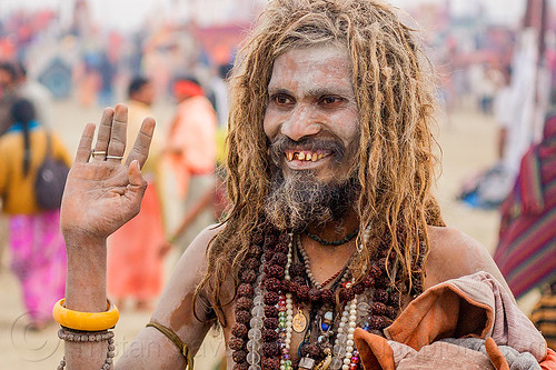 smiling sadhu covered with vibhuti sacred ash - hinduism (india), baba, bad teeth, beard, dreadlocks, hindu pilgrimage, hinduism, holy ash, kumbh mela, man, necklaces, rudraksha beads, sacred ash, sadhu, vibhuti