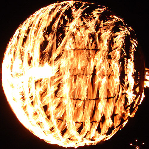 sphere of fire, burning man at night, fire
