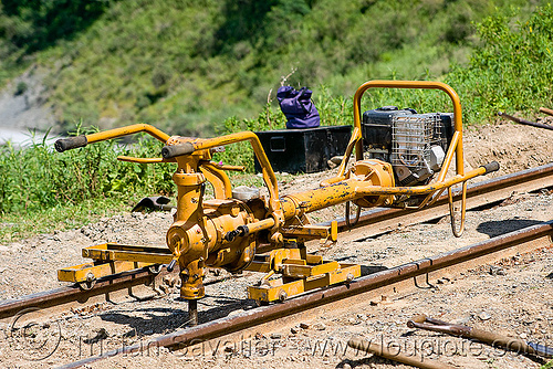 spike driver - tirefonneuse - machine used for screwing rails on ties - track maintenance, argentina, clavadora, equipment, machine, metric gauge, narrow gauge, noroeste argentino, power wrench, railroad construction, railroad spikes, railroad tracks, railway tracks, single track, spike driver, tirefonneuse, track maintenance, tren a las nubes