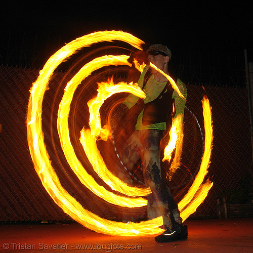 spinning a fire hula hoop - lsd fuego, fire dancer, fire dancing, fire hula hoop, fire performer, fire poi, fire spinning, hula hooping, night, spinning fire