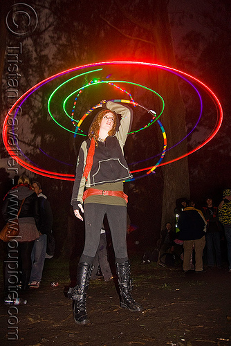 spinning a hula hoop with photon led lights, full moon party, glowing, golden gate park, hooper, hula hoop, hula hooping, led hoop, led lights, light hoop, microlights, night, rave lights, woman