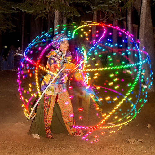 spinning a led hulahoop, glowing, hooping, hulahoop, led hoop, led lights, light hoop, lotus maca moon, night, rainbow colors, star camp, woman