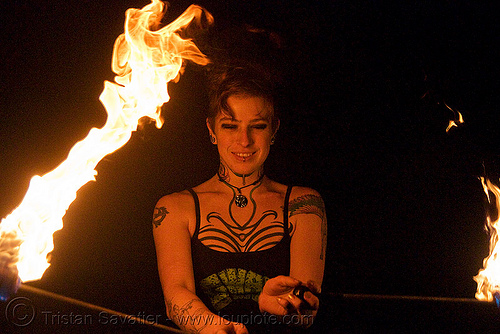 spinning fire poi (san francisco) - fire dancer - leah, fire dancer, fire dancing, fire performer, fire poi, fire spinning, leah, night, spinning fire, tattooed, tattoos, woman