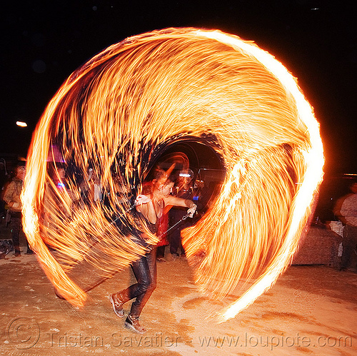 spinning a fire rope - burning man 2010, burning man, circle, fire dancer, fire dancing, fire performer, fire ring, fire rope, fire spinning, night, woman