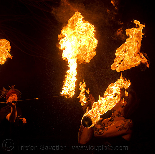 spinning fire staff (san francisco) - fire dancer - leah, fire dancer, fire dancing, fire performer, fire spinning, fire staff, leah, night, spinning fire, tattooed, tattoos, woman
