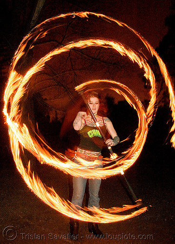 spinning fire staff (san francisco) - fire dancer - leah, fire dancer, fire dancing, fire performer, fire spinning, leah, night, spinning fire, tattooed, tattoos, woman