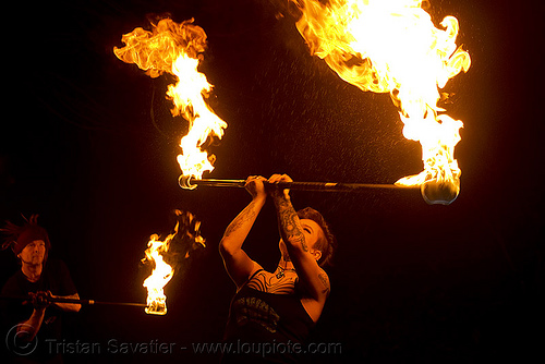 spinning fire staff (san francisco) - fire dancer - leah, fire dancer, fire dancing, fire performer, fire spinning, fire staff, leah, night, spinning fire, tattooed, tattoos, woman