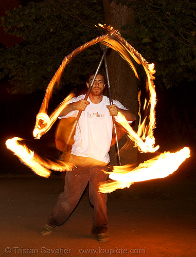 spinning fire staffs (san francisco), double staff, fire dancer, fire dancing, fire performer, fire spinning, fire staffs, fire staves, night, spinning fire