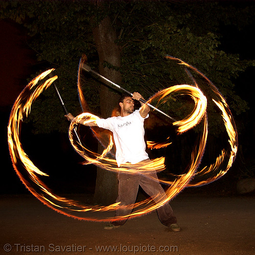 spinning fire staffs (san francisco), double staff, fire dancer, fire dancing, fire performer, fire spinning, fire staffs, fire staves, night, spinning fire