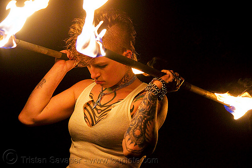 spinning fire staffs (san francisco) - fire dancer - leah, double staff, fire dancer, fire dancing, fire performer, fire spinning, fire staffs, fire staves, leah, night, spinning fire, tattooed, tattoos, woman