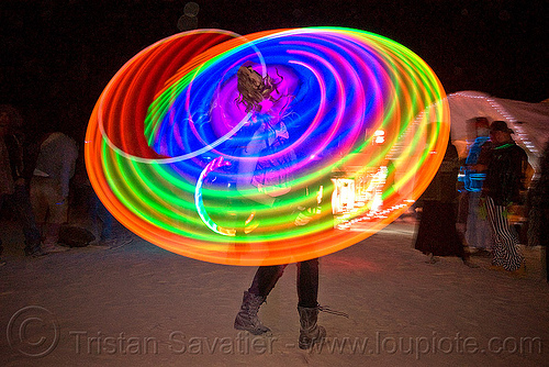 spinning light hulahoop - burning man 2010, burning man, hooping, hula hoops, kaylyn, led hula, light hulas, night, rainbow colors, woman