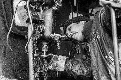 steam locomotive operator adjusting steam locomotive operator adjusting hydrostatic lubricator (india), 788 tusker, controls, darjeeling himalayan railway, darjeeling toy train, hydrostatic displacement lubricator, hydrostatic lubricator, man, mechanical lubricator, narrow gauge, operator, railroad, steam engine, steam locomotive, steam train engine, valves, worker, working