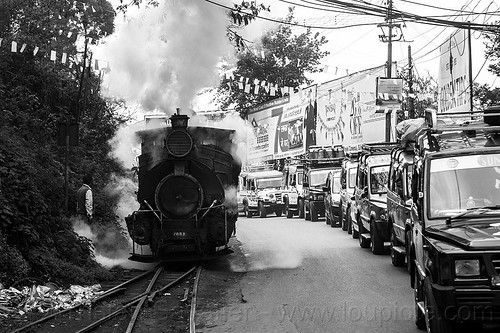 steam locomotive sharing road with cars - darjeeling (india), 788 tusker, cars, darjeeling himalayan railway, darjeeling toy train, narrow gauge, railroad switch, railroad tracks, road, smoke, smoking, steam engine, steam locomotive, steam train engine, traffic jam