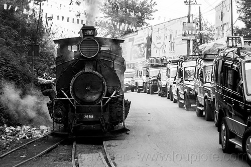 steam locomotive sharing road with cars - darjeeling (india), 788 tusker, cars, darjeeling himalayan railway, darjeeling toy train, man, narrow gauge, operator, railroad tracks, road, smoke, smoking, steam engine, steam locomotive, steam train engine, traffic jam, worker