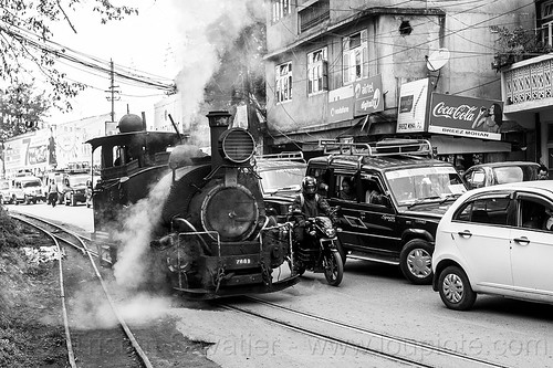 steam locomotive sharing road with cars traffic - darjeeling (india), 788 tusker, cars, darjeeling himalayan railway, darjeeling toy train, motorcycle, narrow gauge, railroad switch, railroad tracks, road, smoke, smoking, steam engine, steam locomotive, steam train engine, traffic jam