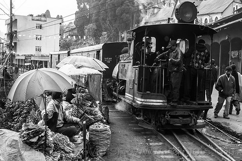 steam train departing from darjeeling (india), 782 mountaineer, darjeeling himalayan railway, darjeeling toy train, farmers market, men, narrow gauge, operator, railroad, salads, stall, steam engine, steam locomotive, steam train engine, street market, street seller, train cars, train station, umbrellas, vegetables, vendors