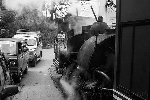 steam train sharing the road with cars - darjeeling (india), 788 tusker, cars, darjeeling himalayan railway, darjeeling toy train, man, narrow gauge, operator, railroad, road, smoke, smoking, steam engine, steam locomotive, steam train engine, train car