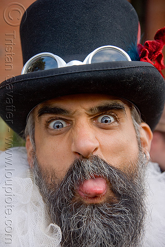 steven raspa - burning man decompression, beard, color contact lenses, contacts, goggles, hat, man, special effects contact lenses, steven raspa, sticking out tongue, sticking tongue out, theatrical contact lenses