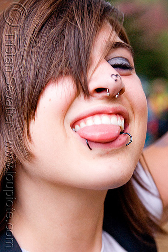 sticking tongue out - snake bite lip piercing, golden gate park, jess, lip piercing, nose piercing, party, raver, septum piercing, snake bites piercing, sticking out tongue, sticking tongue out, woman