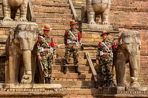 stone elephants at fasidega temple - nepali gurkha army soldiers (nepal), bhaktapur, durbar square, elephants, fatigues, gorkhas, guards, gurkha army, gurkha regiment, gurkhas, hat, hindu temple, hinduism, men, military, nepalese army, red stripe, sculptures, soldiers, stairs, statues, steps, stone elephant, uniform