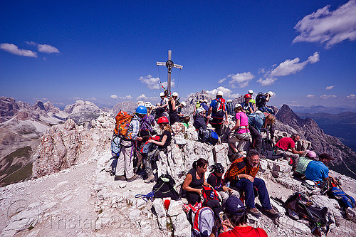 summit of monte paterno, alps, blue sky, christian cross, climbers, climbing harness, climbing helmet, crowd, crowded, crucifix, dolomites, montaineers, monte paterno, mountain climbing, mountaineer, mountaineering, mountains, parco naturale dolomiti di sesto, rock climbing, summit, via ferrata