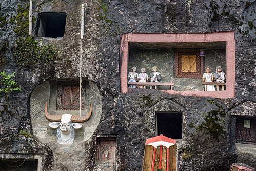 tau-tau effigies and water buffalo carving - lembang tonga riu - lo'ko mata wall - toraja rock tombs, burial site, cemetery, effigies, graves, graveyard, lembang tonga riu, liang pak, lo'ko mata wall, pa'tedong, rock tombs, tana toraja, tau-tau