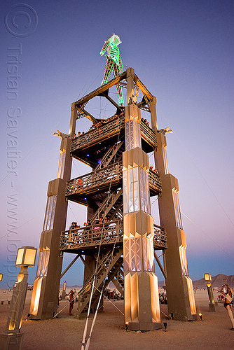 "the burning man" on top of its art deco tower, art deco, dawn, the man, tower
