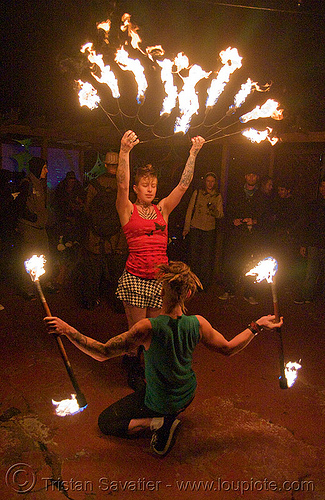 the fire of love - leah and ro spinning fire (san francisco) - fire dancer, double staff, fire dancer, fire dancing, fire fans, fire performer, fire spinning, fire staffs, fire staves, leah, love, man, night, spinning fire, tattooed, tattoos, woman
