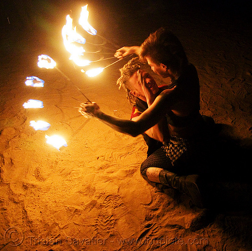 the fire of love - leah and ro with fire fans (san francisco) - fire dancer, fire dancer, fire dancing, fire fans, fire performer, fire spinning, leah, love, man, night, spinning fire, tattooed, tattoos, woman