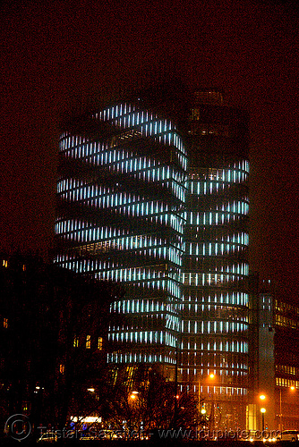 the led-light-morphing uniqa tower in vienna, building, glowing, high-rise, led lights, morphing, night, tower, twists and turns, vienna, wien