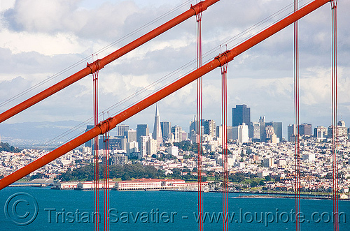 through the golden gate bridge, buildings, city, cityscape, cloudy sky, coast, downtown, financial district, golden gate bridge, landscape, ocean, san francisco bay, san francisco skyline, sea, skyscrapers, suspension bridge, suspension cables, waterfront