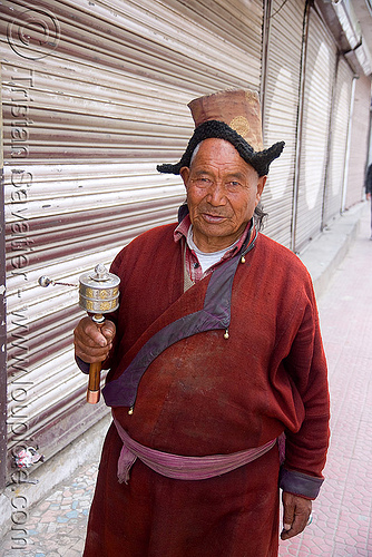 tibetan monk spinning prayer wheel, hat, ladakh, leh, man, monk, prayer mill, prayer wheel, tibetan