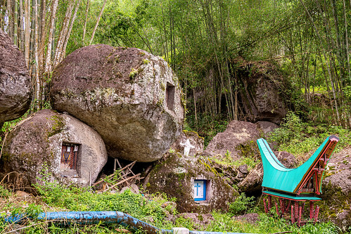 toraja rock-tombs with miniature tongkonan structure, boulder, burial site, cemetery, graves, graveyard, liang pak, miniature tongkonan, rock tombs, tana toraja, tongkonan roof