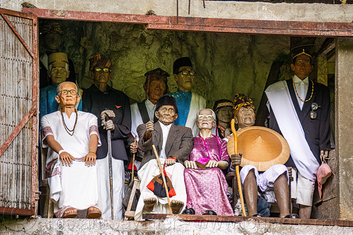 toraja tau-tau effigies of dead people in londa cave burial site, effigies, londa burial cave, londa cave, tana toraja, tau-tau, wooden statues