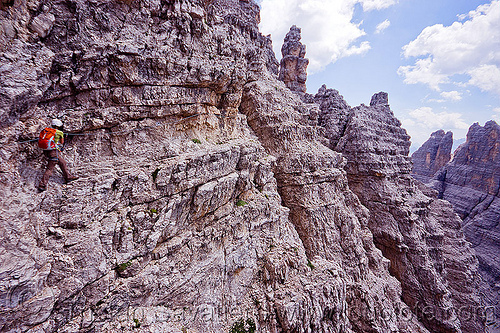 trail on ledge - monte paterno via ferrata, alps, cliff, climber, climbing harness, climbing helmet, dolomites, monte paterno, mountain climbing, mountaineer, mountaineering, mountains, parco naturale dolomiti di sesto, rock climbing, trail, vertical, via ferrata, woman