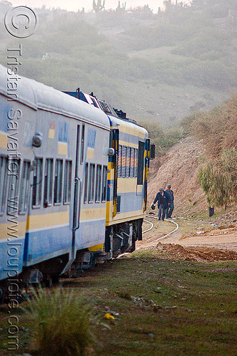 train stopped and operators checks funky looking rails ahead (bolivia), altiplano, bolivia, control, deformed, enfe, examination, expreso del sur, fca, pampa, railroad tracks, railway tracks, stopped, train